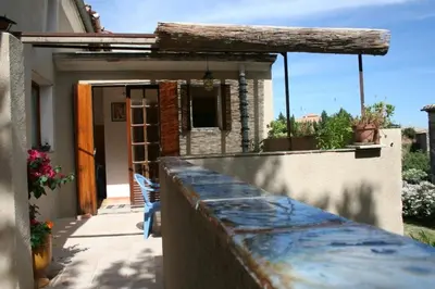 a balcony of a house with a fence at Gite Le Lavoir - La Poterie in Caunes-Minervois