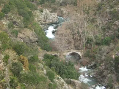 an aerial view of a river with a bridge at Gite la Tour in Pépieux