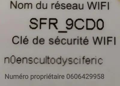 a sign with the writing on the side of a building at Le Minervois in Carcassonne
