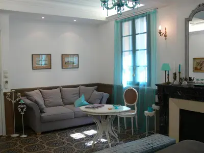 a living room with a couch and a table at Maison d'hôte la Tourette in Cucugnan