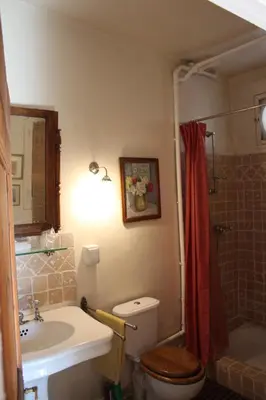 a bathroom with a toilet and a sink and a shower at Sous l'abricotier in Durban-Corbières