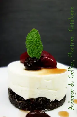 a piece of cake with whipped cream and fruit on top at Auberge du Cellier in Montner