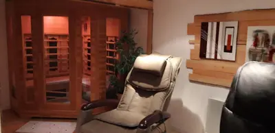 a rocking chair in a room with a door at Camping la Source in Sournia