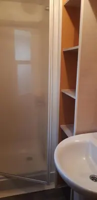 a bathroom with a shower next to a sink at Camping la Source in Sournia