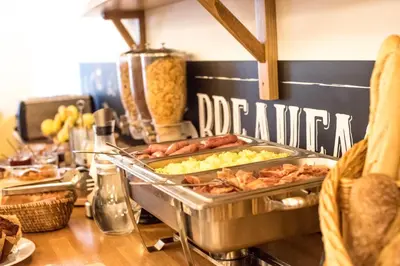 a buffet with many different types of food on a table at Cerise Carcassonne Sud in Carcassonne