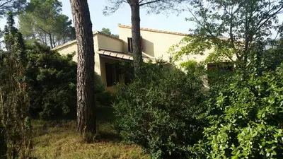 a house in the middle of some trees at Le Cers in Ribaute