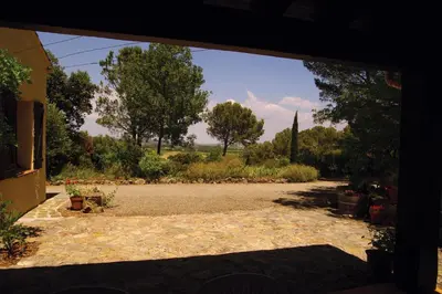a view of a driveway from an open doorway at Le Cers in Ribaute