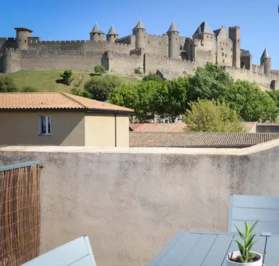 a view of a castle from the roof of a house at La Terrasse de Jules in Carcassonne