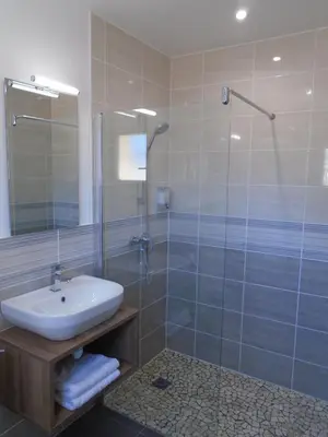 a bathroom with a sink and a shower at Studio les trois chemins in Cucugnan
