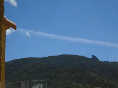 a view of a mountain with a crane at Studio les trois chemins in Cucugnan
