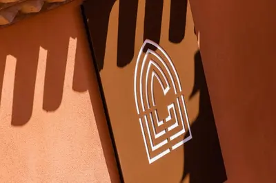 a close up of a keyboard with a shadow on a table at Le Couvent - Hostel in Carcassonne