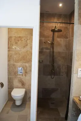 a bathroom with a toilet and a shower at GOOD KNIGHT in Carcassonne