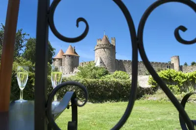 a view of a castle through a window at GOOD KNIGHT in Carcassonne