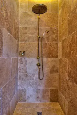 a shower with a shower head in a bathroom at GOOD KNIGHT in Carcassonne
