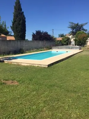 a large swimming pool in a yard at GITE Florence et Francis in Cuxac-dʼAude