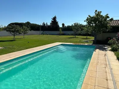 a swimming pool in a yard next to at GITE Florence et Francis in Cuxac-dʼAude