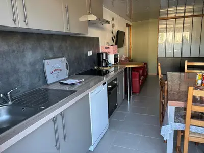 a kitchen with a sink and a counter top at B & B Florence et Francis in Cuxac-dʼAude