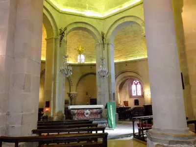 a church with pillars and aasteryasteryasteryasteryasteryasteryasteryasteryasteryastery at Studio l'Obrador 25 m2 - Cuisine & terrasse - accès piscine in Rieux-Minervois