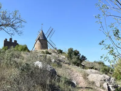 a windmill on top of a hill at Roquebrun Villa with Pool in Roquebrun