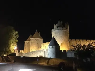 a castle at night with its lights on at Comfortable villa with jacuzzi in Montbrun-des-Corbières