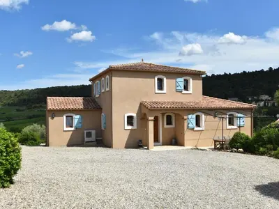 a house on a hill with a gravel driveway at Luxe Villa in Montbrun in Montbrun-des-Corbières