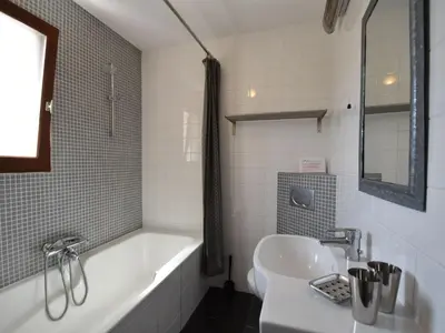 a bathroom with a bath tub and a sink at Luxe Villa in Montbrun in Montbrun-des-Corbières