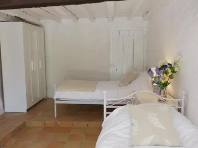 a small room with a bed and a window at Gîtes de Montcabirol in Mirepoix