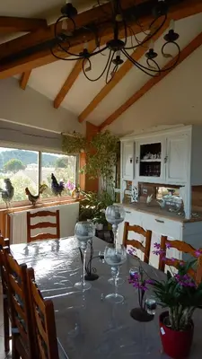 a kitchen with a table with wine glasses on it at La Maison de Fafa in Carcassonne