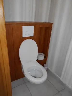 a bathroom with a white toilet in a room at La Colombe in Revel