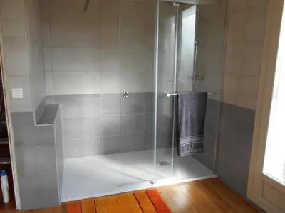 a shower with a glass door with a towel at La Colombe in Revel