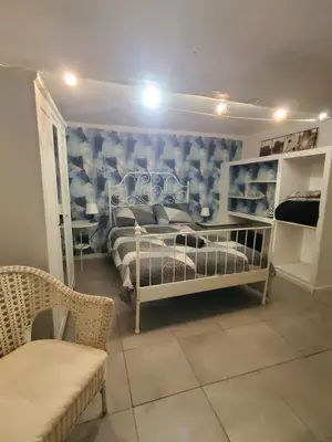 a bedroom with two bunk beds and a couch at REPUBLIQUE Centre in Carcassonne