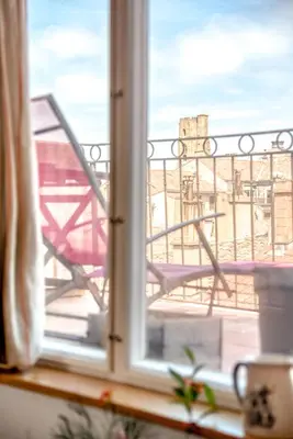a view of a balcony from a window at Wine Loft, Terrasse et Vue extraordinaire sur la cité médiévale in Carcassonne