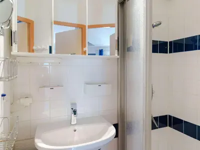 a white bathroom with a sink and a shower at Charmant pavillon 3 chambres avec véranda près plage Grazel – Parking sécurisé - FR-1-409-144 in Gruissan