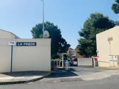a garage with a sign that reads la paza at La Pinède in Gruissan