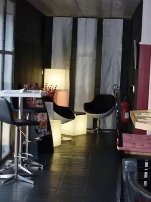 a room with two chairs and a table in a room at Fasthotel Narbonne in Narbonne