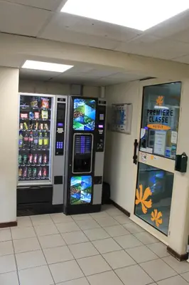 two vending machines in a store with soda machines at Hôtel Premiere Classe Pamiers in Pamiers