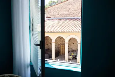 a view of a building from a window at L'écrin de l'Orb in Cessenon