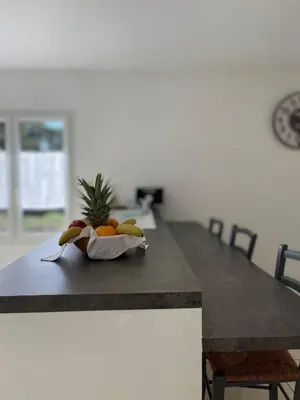 a bowl of fruit sitting on top of a kitchen counter at Au Perchoir in Caunes-Minervois