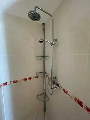 a shower with a shower head in a bathroom at Au Perchoir in Caunes-Minervois