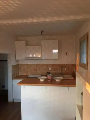 a kitchen with two sinks and a counter top at MAS DES VIGNES - View Cité de Carcassonne in Carcassonne