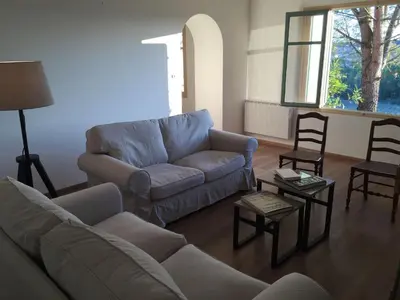 a living room with a couch and two chairs at MAS DES VIGNES - View Cité de Carcassonne in Carcassonne