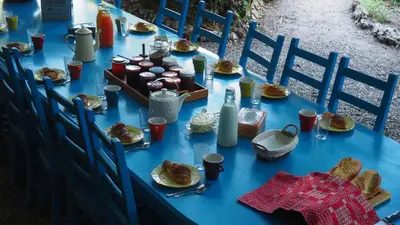 a blue table with food and bread on it at Maison du Parc in Saint-Chinian