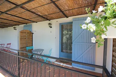 a bathroom with a sink and a toilet at Le Jardin du Somail in Le Somail