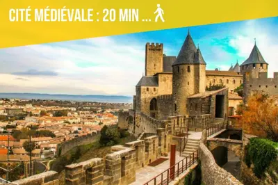 a poster of a castle with a city at City'IN Appart in Carcassonne