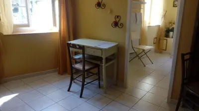 a room with a desk and a chair and a window at Au Coeur de Rennes Chambres d'hôtes in Rennes-les-Bains