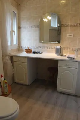 a bathroom with a sink and a mirror at Au Coeur de Rennes Gîte in Rennes-les-Bains