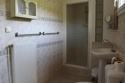 a bathroom with a shower and a sink at Au Coeur de Rennes Gîte in Rennes-les-Bains