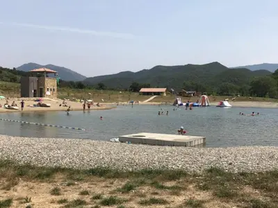 a group of people in the water at a beach at Modern Boulangerie, large 6 bedroom village house in Quillan