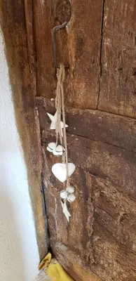 a group of sandals sitting on a wooden door at Le Chateau in Camps-sur-lʼAgly