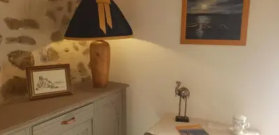 a lamp sitting on top of a dresser in a room at Le Chateau in Camps-sur-lʼAgly